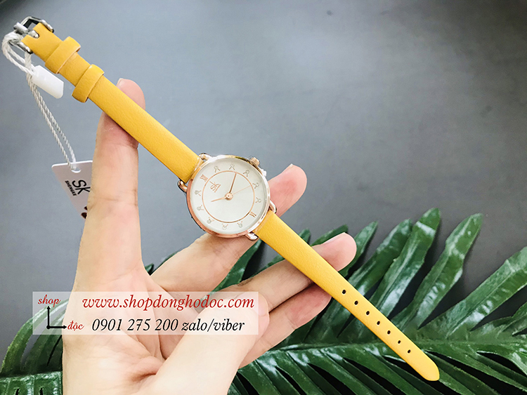 Đồng hồ Sk nữ dây da mặt tròn vàng pastel thời thượng ĐHĐ19301